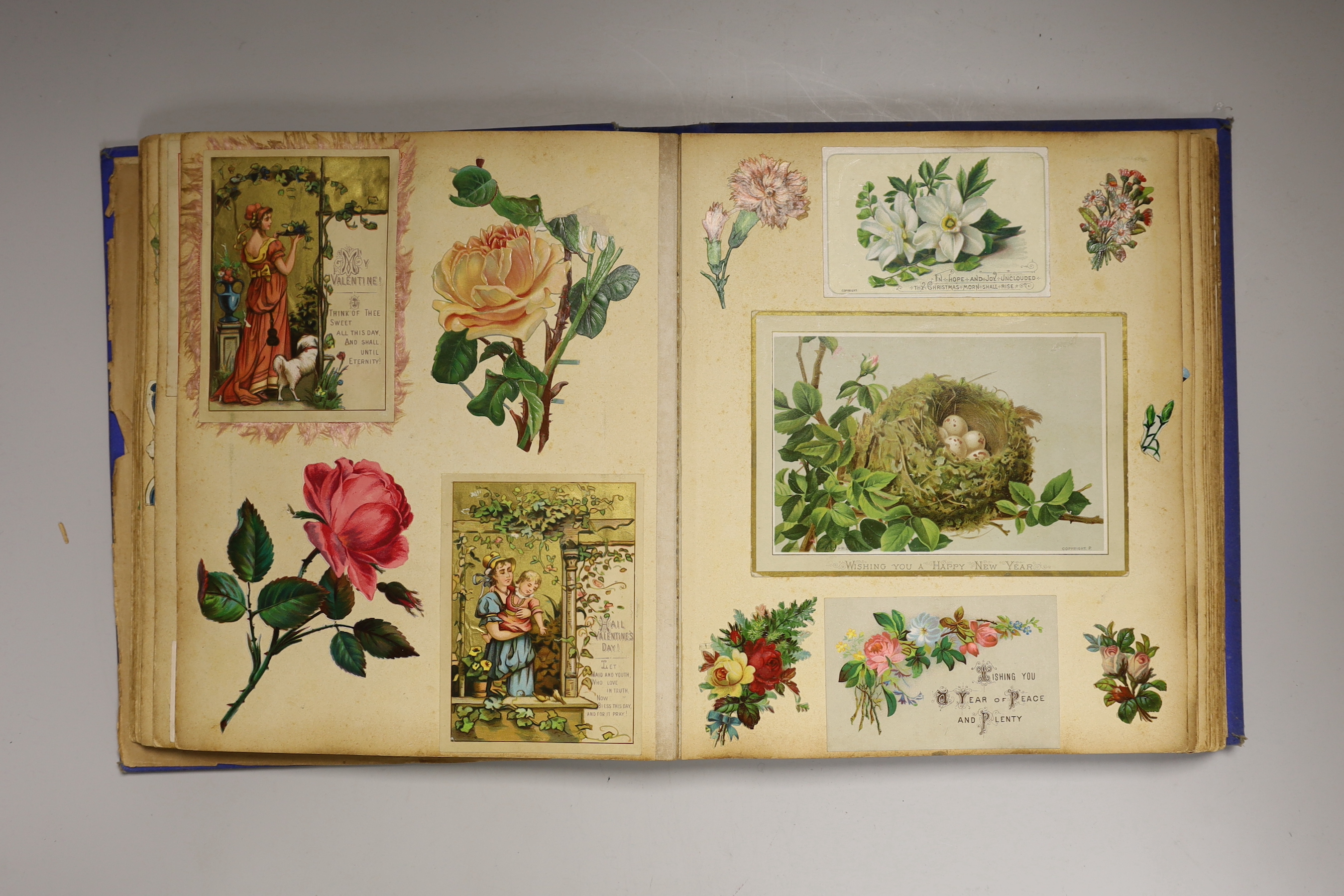 A Victorian photograph album and contents together with an Edwardian scrap book (2)